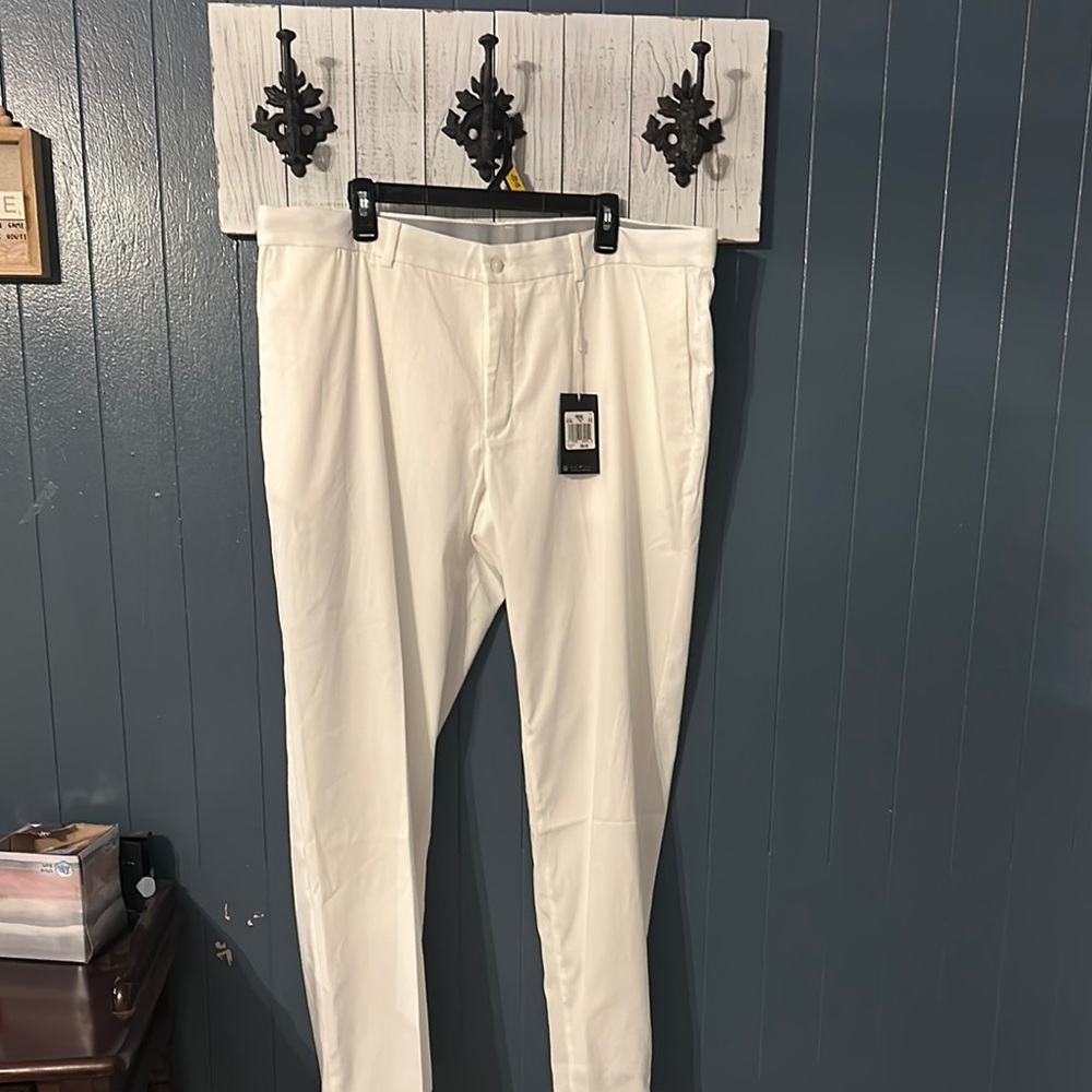 Nike Golf White standard  fit. Dri fit. golf pants are made to keep you cooler.